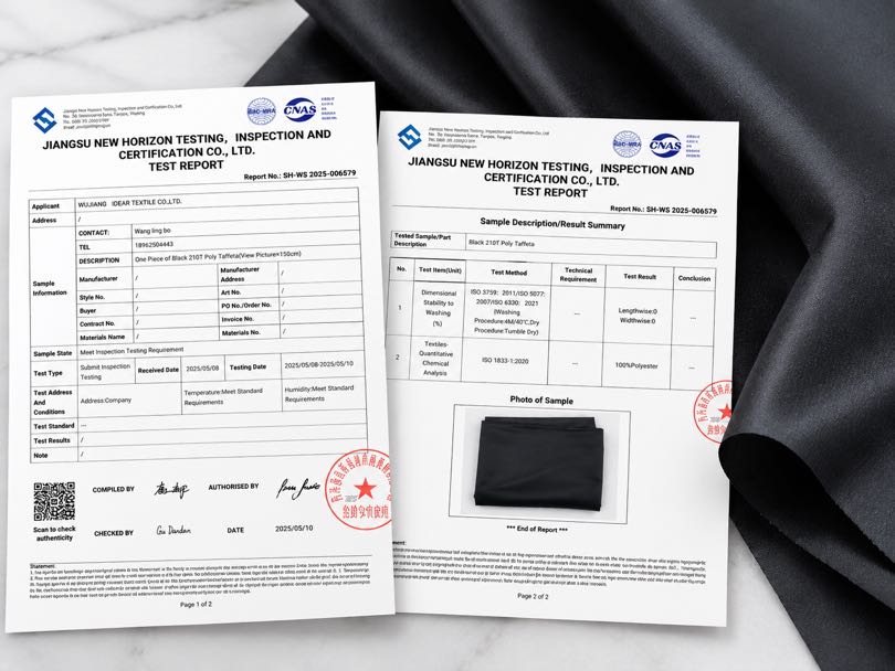 Third-party test report for black 210T polyester taffeta showing fiber composition and dimensional stability results.