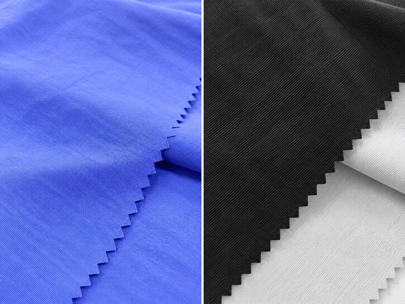 Side-by-side comparison of blue nylon Taslan fabric and black polyester Taslan fabric showing their different textures