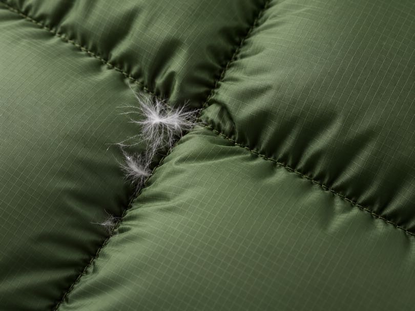 High-density taffeta fabric displayed with a down jacket made from similar lightweight material.